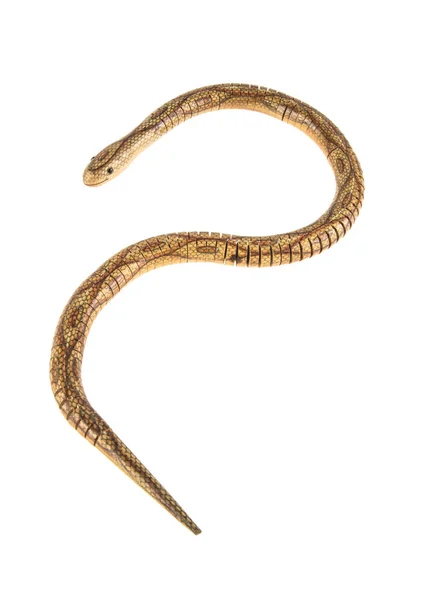 Деревянная игрушечная змея на белом изолированном фоне — стоковое фото