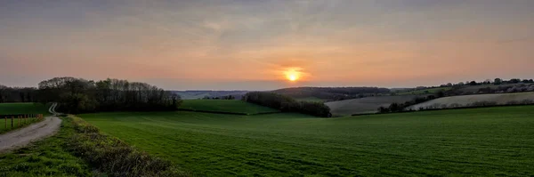 Panoramic view of landscape overlooking fields at sunset in The Chilterns, England