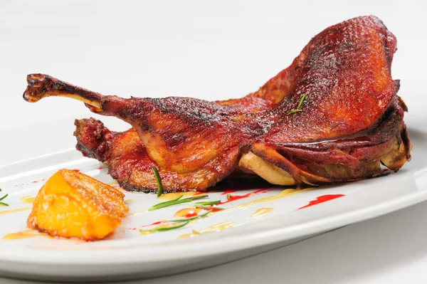 Roast half of duck with caramelized lemon — Stock Photo, Image