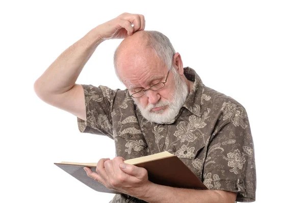 Senior man reading a book, isolated on white — Stock Photo, Image