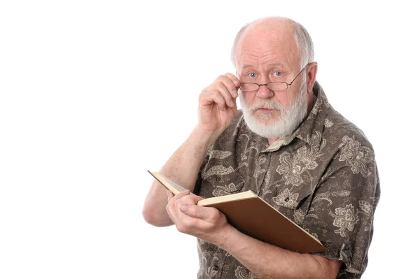 Senior man reading a book, isolated on white — Stock Photo, Image