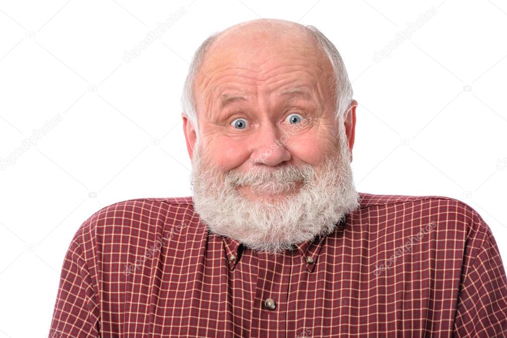 Senior man shows surprised smile facial expression, isolated on white