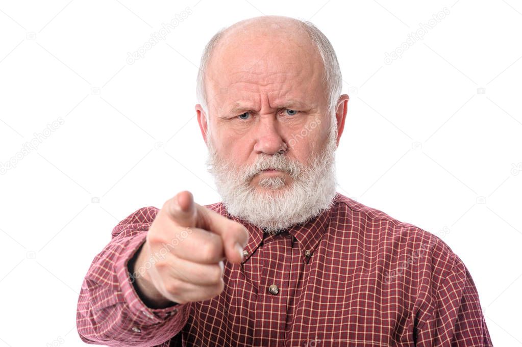 Senior man points the index finger to camera, isolated on white