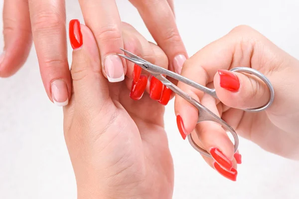 Cuticles cutting with scissors — Stock Photo, Image