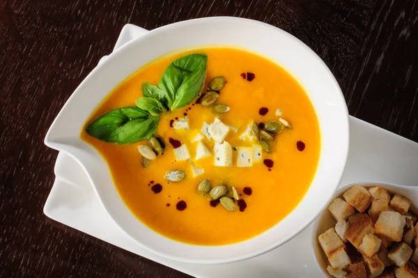 Pumpkin and soup with cream and pumpkin seeds — Stock Image Pumpkin and soup with cream and pumpkin seeds Stock Photo