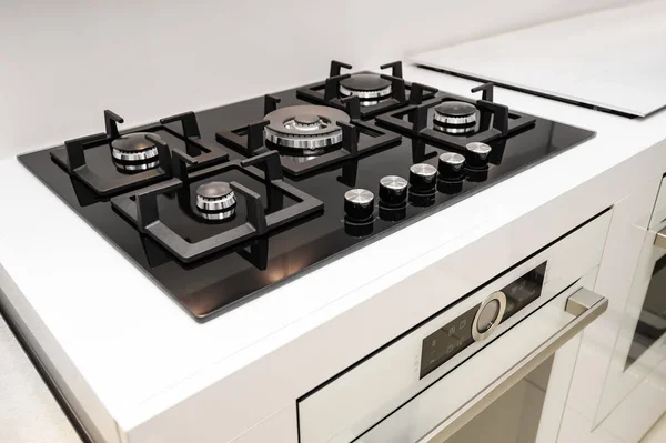 Brand new gas stove and embedded oven — Stock Photo, Image