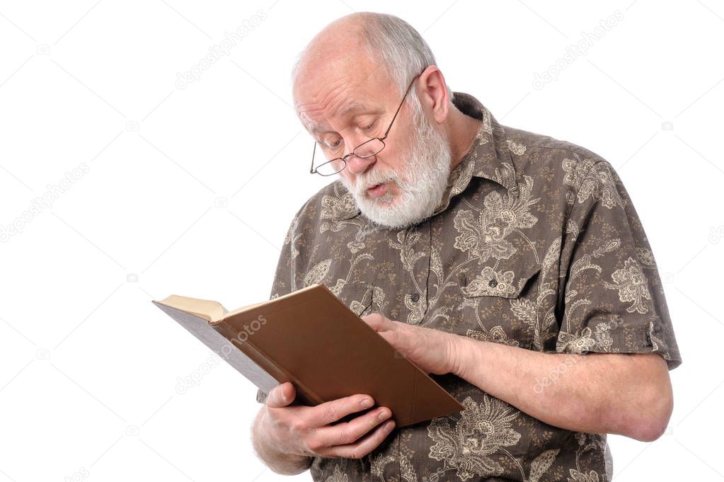Senior man with glasses reading a book