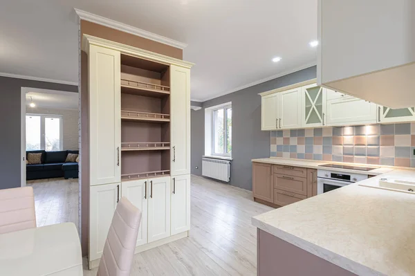 Luxury modern provence styled grey, pink and cream kitchen interior