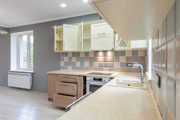 Luxury modern provence styled grey, pink and cream kitchen interior