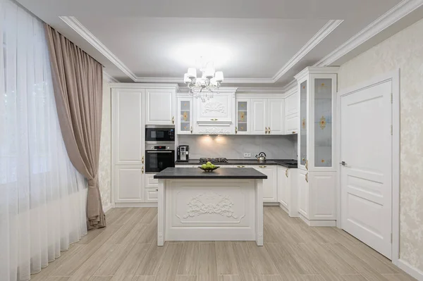 White luxury modern kitchen with island — Stock Photo, Image