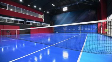 Blue colored empty indoor tennis court