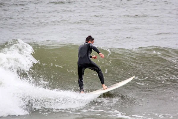 Surfer in baltic sea latvia, North pole, liepaja. photo taken 06.25.2017 — Stock Photo, Image