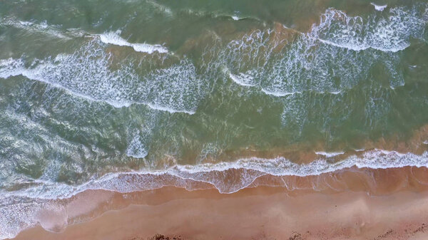 Aerial Dron Shot of the Baltic Sea Costline With Waves View From Above. Sea Waves Over a Sandy Beach.top View of Sea Waves Foaming and Splashing, Big Waves From Above