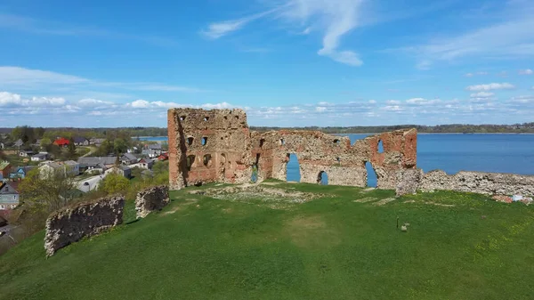 Aerial View of the Ludza Medieval Castle Ruins on a Hill Between Big Ludza Lake and Small Ludza Lake. The Ruins of an Ancient Castle in Latvia.