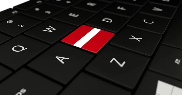 Letland vlag knop op laptop toetsenbord. — Stockfoto