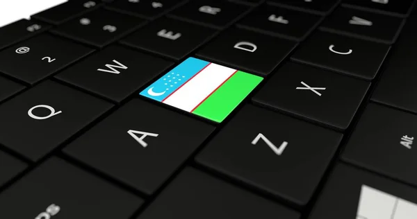 Uzbekistan flagga knappen på laptop tangentbord — Stockfoto