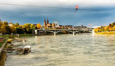 Old city center of Basel with Munster cathedral and the Rhine river in Switzerland clipart