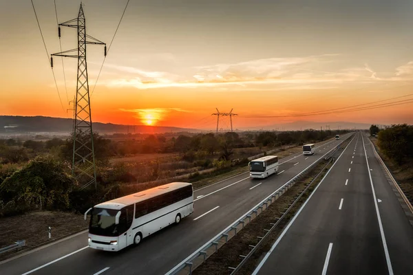 Caravan Convoy Four Buses Line Traveling Country Highway Amazing Orange — Stock Photo, Image