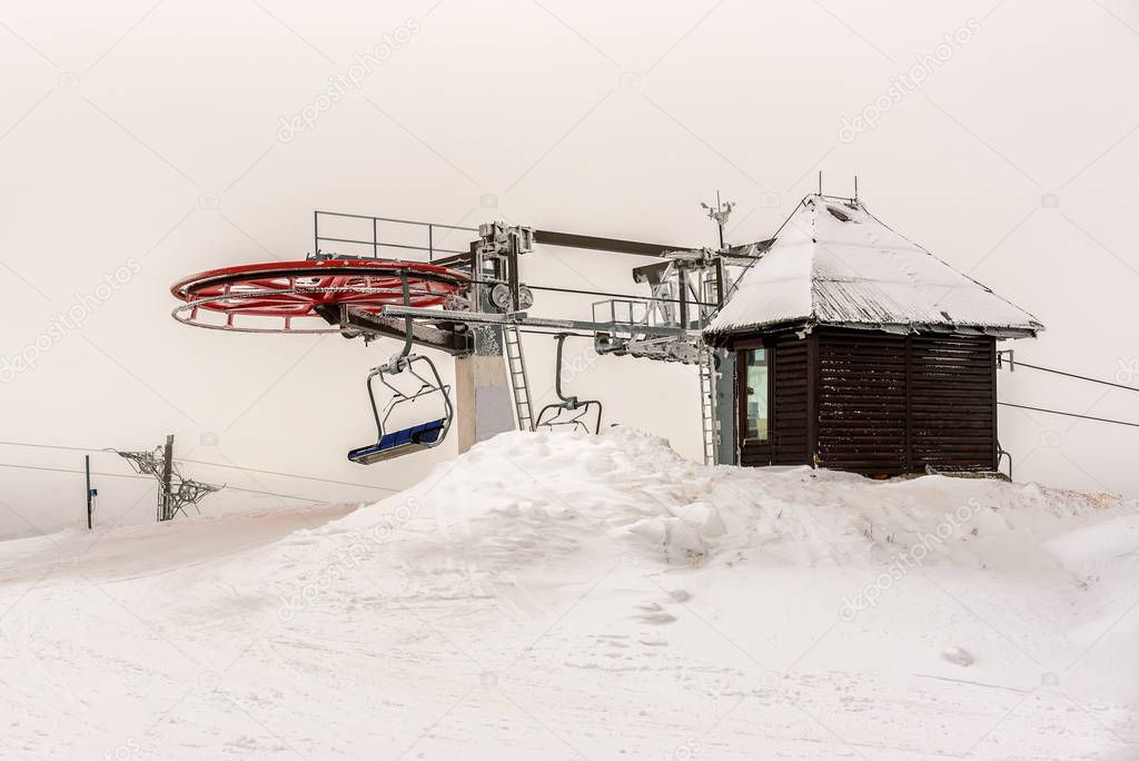 Ski lift on ski resort in winter. Kopaonik, Serbia. Winter landscape