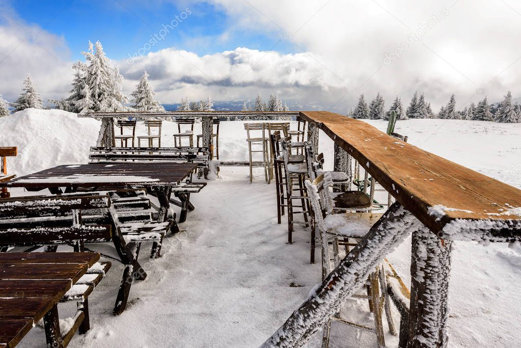 Outdoors restaurant tables in the snowy winter landscape, Kopaonik, Serbia