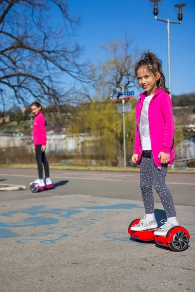 Girls on the hoverboard — Stock Photo, Image