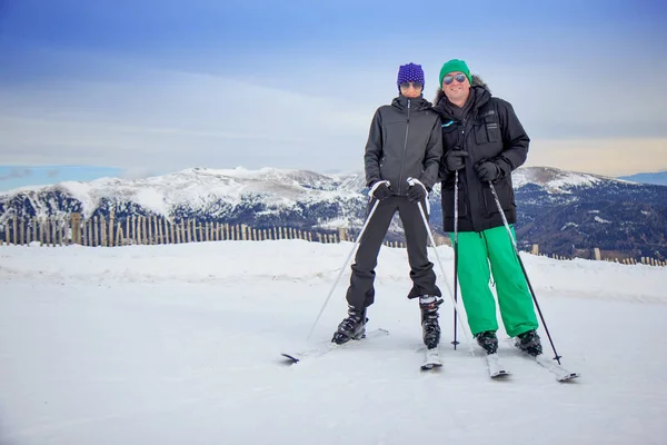 Couple on the snow with ski