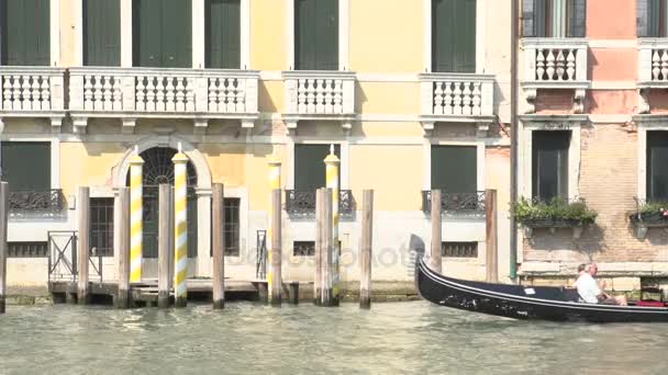 Yellow poles with boats passing by in the foreground — Stock Video