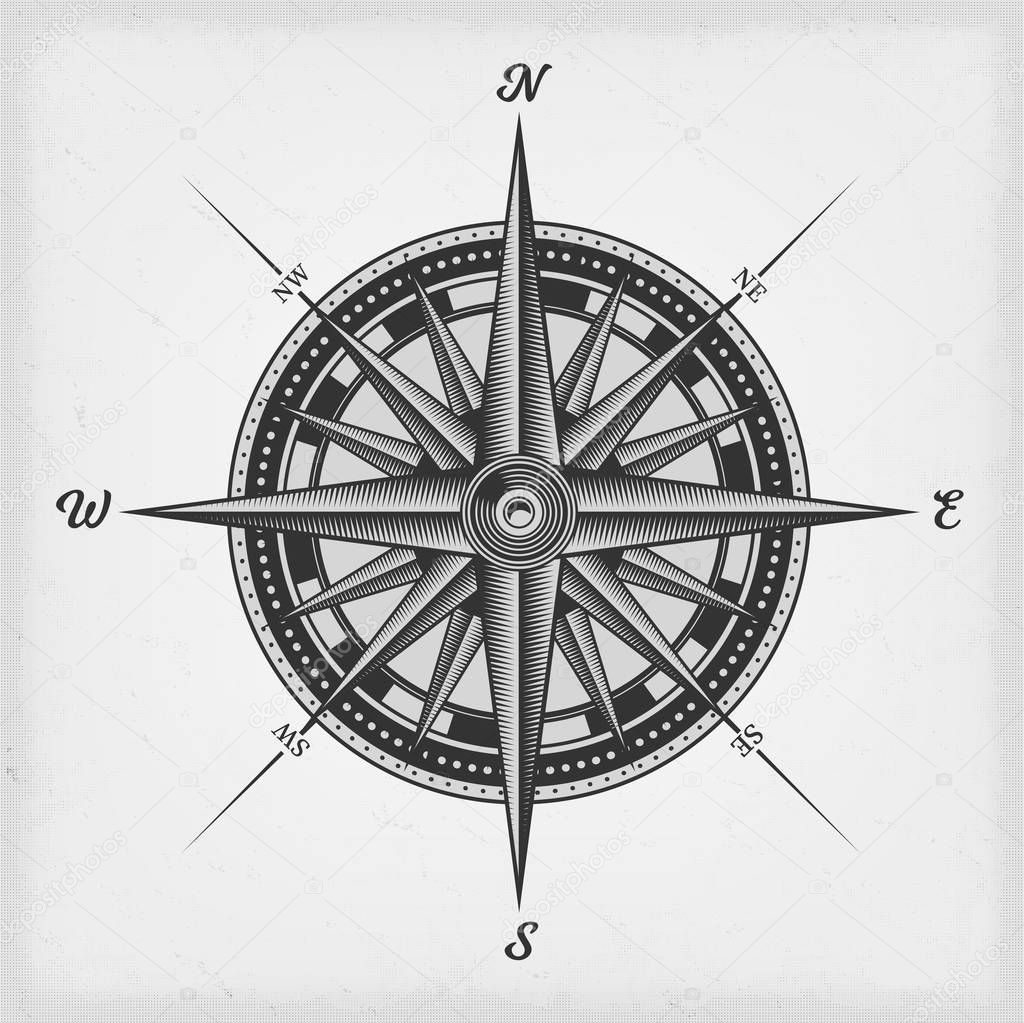 Black and white nautical compass rose on vintage old textured background