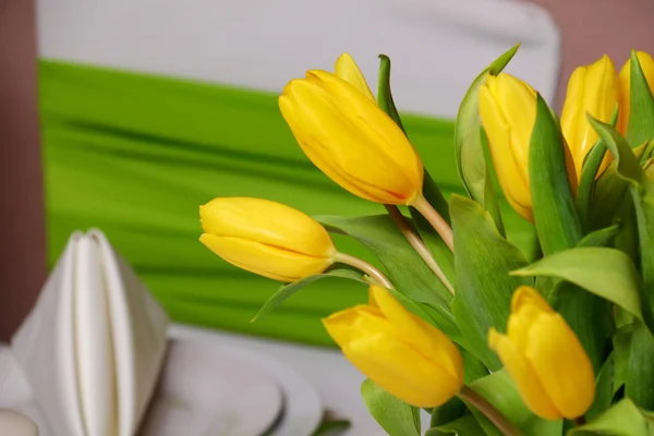 Decoration of yellow tulips for a holiday.