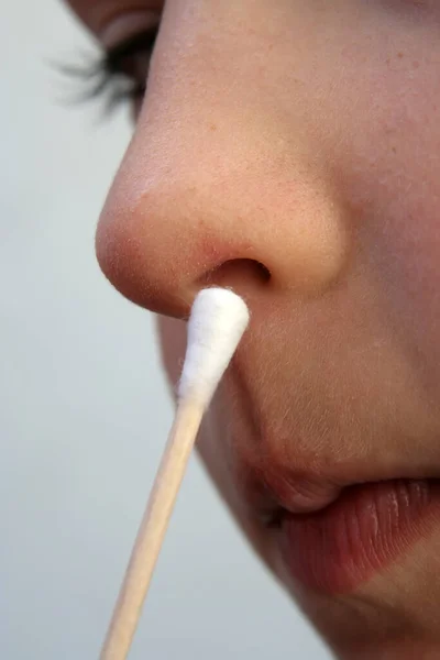 Child taking swab. Medical examination. Medical testing child.