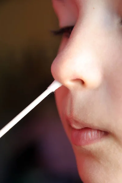 Child taking swab. Medical examination. Medical testing child.