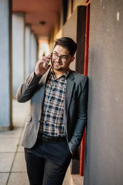 Young man talking on his mobile phone