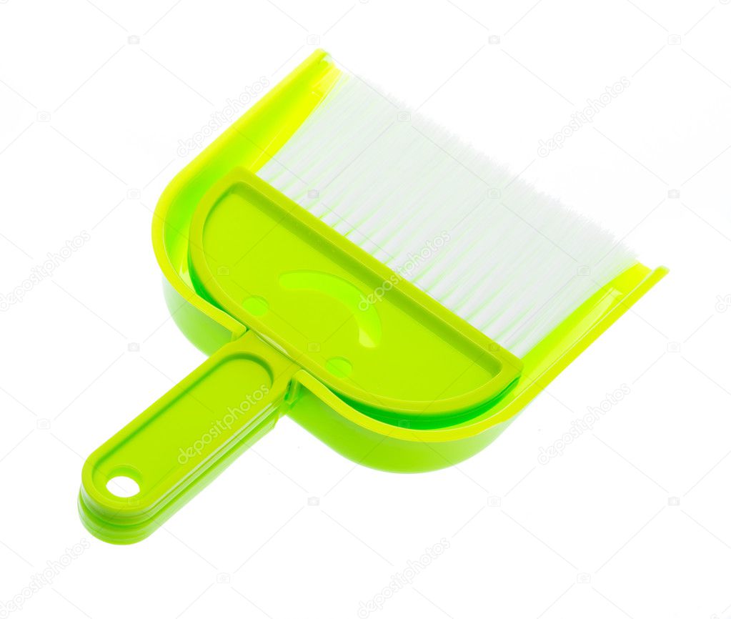 plastic green brooms and dust pan isolated on white background