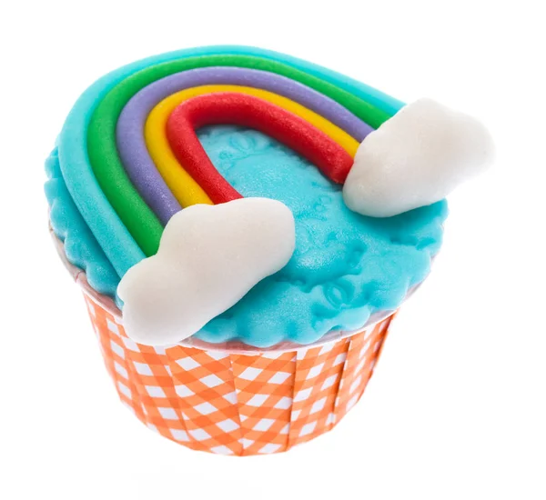 Cupcake and icing candy rainbow on top isolate on white — Stock Photo, Image
