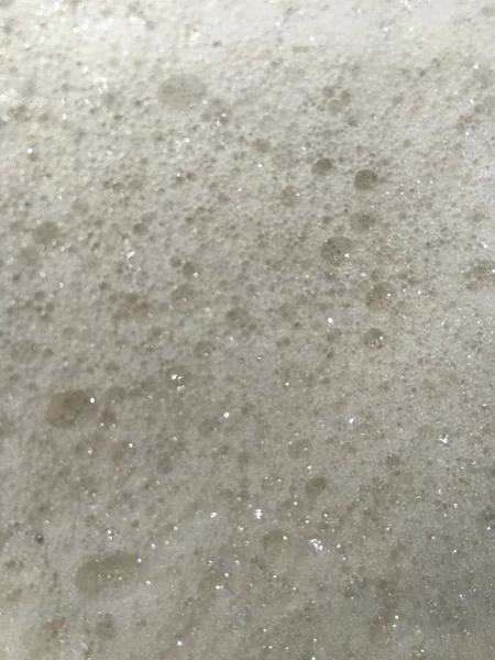 Tvål eller öl bubblor bakgrund — Stockfoto