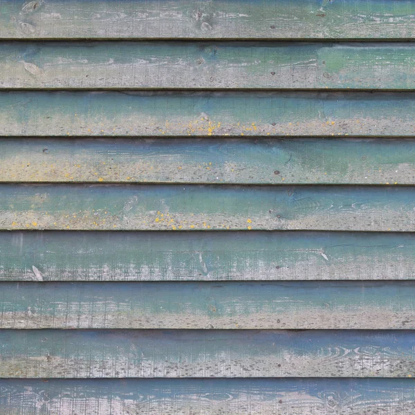 Part of shed wall consisting of old wooden planks with faded gre — Stock Photo, Image