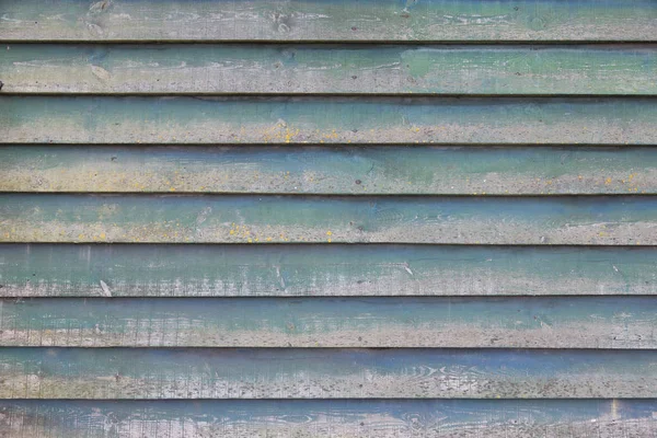 Part of shed wall consisting of old wooden planks with faded gre — Stock Photo, Image