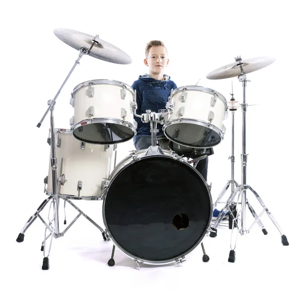 Teenage boy behind drum kit in studio — Stock Photo, Image