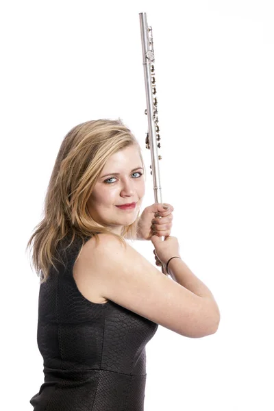 Young blond woman and flute against white background — Stock Photo, Image