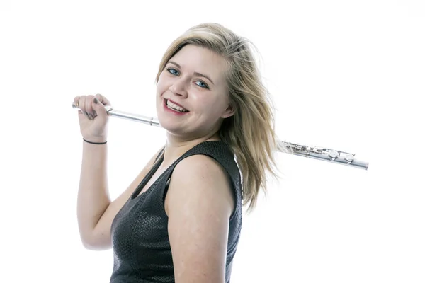 Young blond woman and flute against white background — Stock Photo, Image