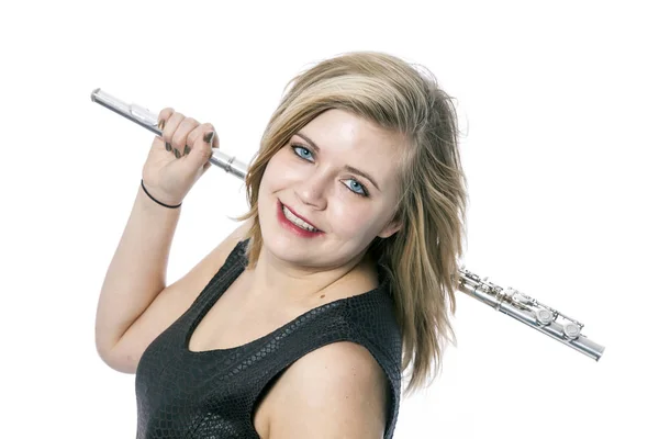 Young blond woman and flute against white background — Stock Photo, Image