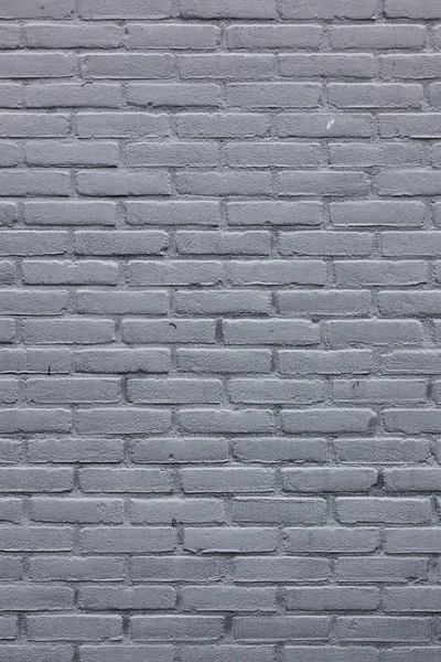 Вертикальная часть кирпичной стены с серой краской — стоковое фото
