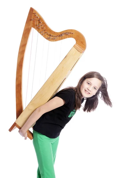 Young girl in black shirt with harp on het back in studio — Stock Photo, Image