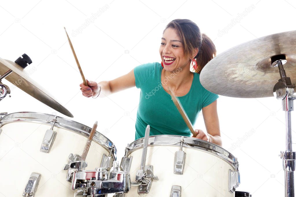 brunette brazilian woman plays the drums in studio