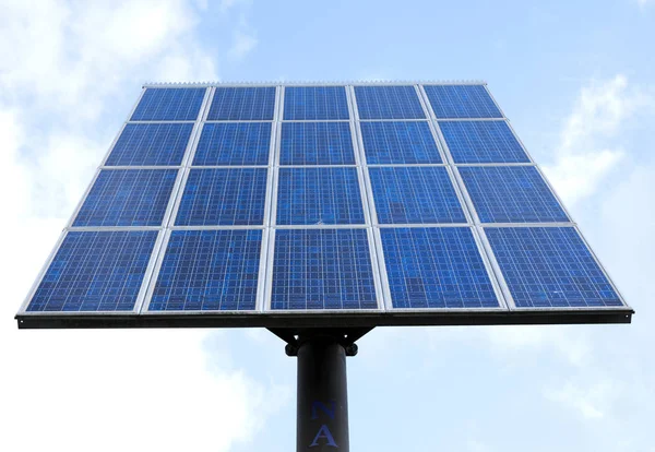 Solar panels and blue sky with clouds — Stock Photo, Image