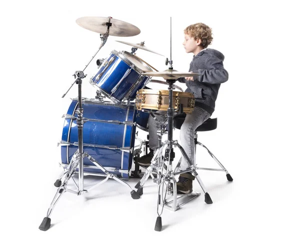 Young blond caucasian boy at drumset in studio — Stock Photo, Image