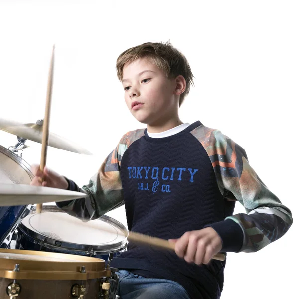 Young blond boy at drum kit in studio — Stock Photo, Image