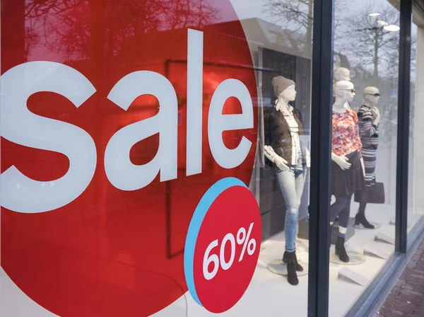 The word sale in shopping window during winter sale time — Stock Photo, Image