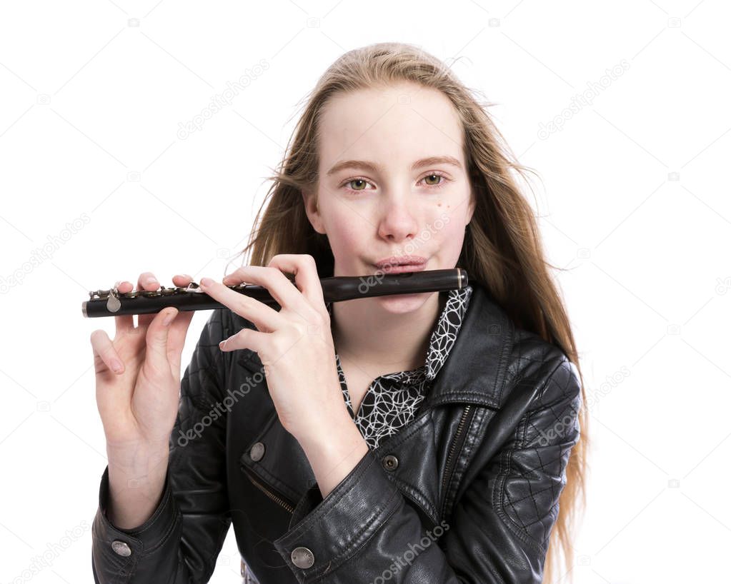 young blond teen girl and piccolo flute in studio against white background