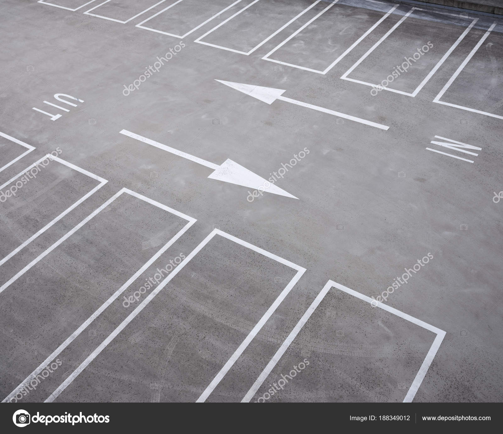 White Lines And Arrows In Dutch Parking Garage Stock Photo